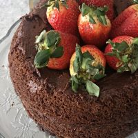 Paleo chocolate cake recipe! Layered chocolate cake topped with strawberries. With superfood addition that my kids love!