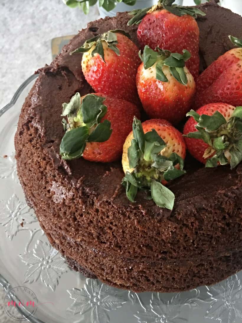 Paleo chocolate cake recipe! Layered chocolate cake topped with strawberries. With superfood addition that my kids love!