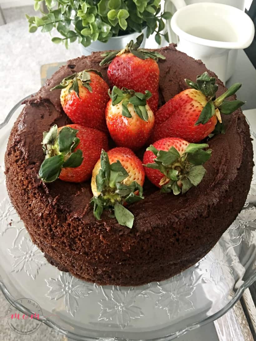 Paleo chocolate cake recipe! Layered chocolate cake topped with strawberries. With superfood addition that my kids love!