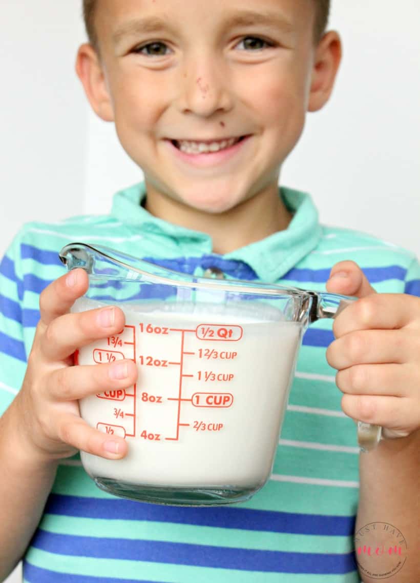 whipping cream in a measuring cup