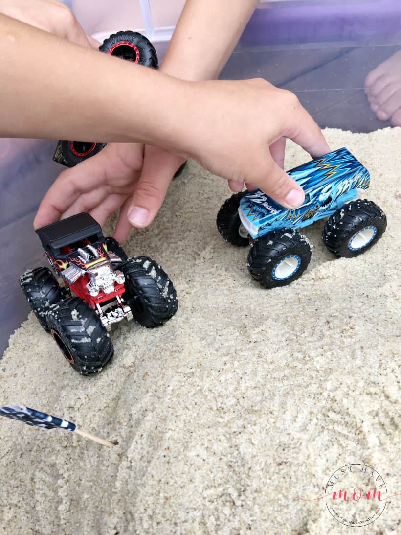 boys playing with monster trucks