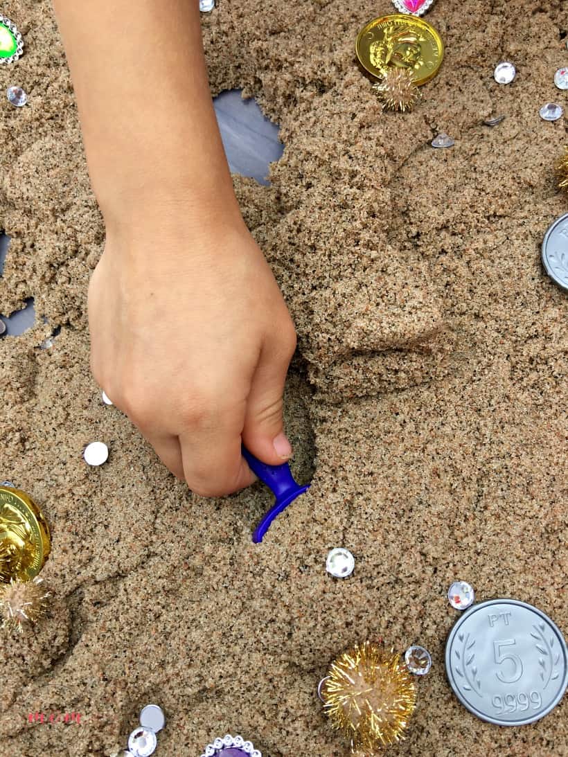 scooping kinetic sand