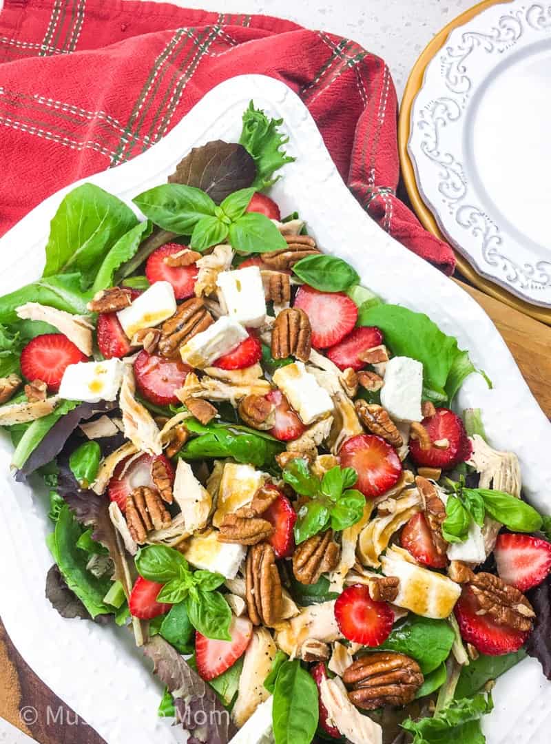 This Strawberry Chicken Salad is loaded with feta, pecans and a basalmic dressing. Make the chicken in the Instant Pot for a fast, delicious meal. 