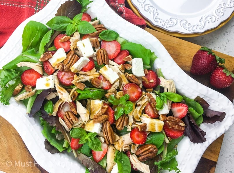 This Strawberry Chicken Salad is loaded with feta, pecans and a honey dijon dressing. Make the chicken in the Instant Pot for a fast, delicious meal. 
