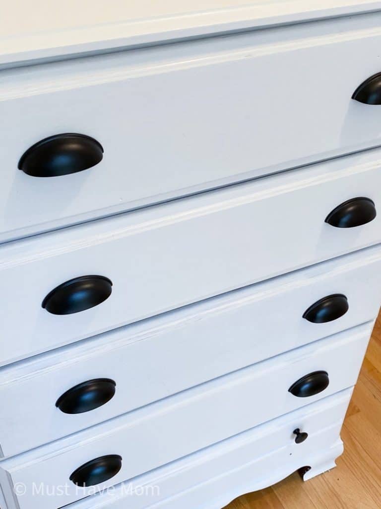 White dresser with store black handles