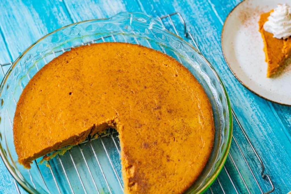 Crustless pumpkin pie on a blue table 